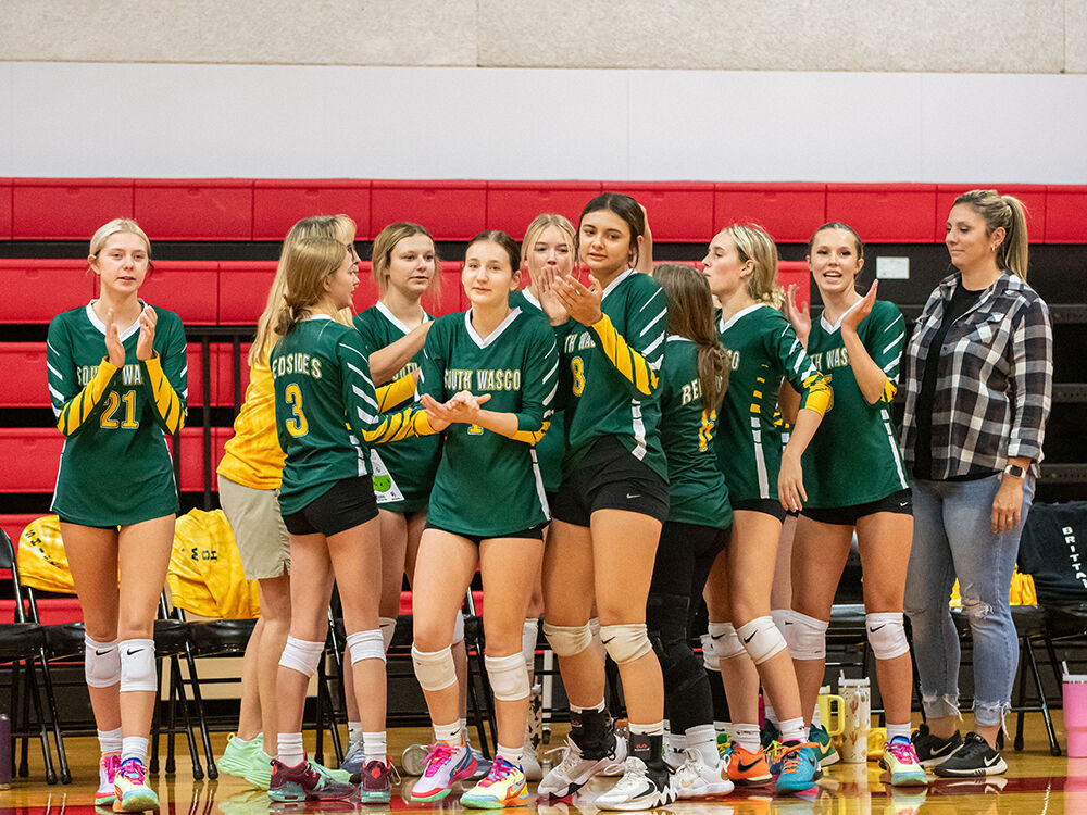 The South Wasco volleyball team celebrates after a game. Noah Noteboom photo